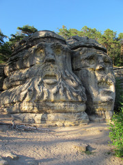 Fototapeta na wymiar Sandstone rock formation Devils heads (Certovy hlavy) near Zelizy village. Czech Republic