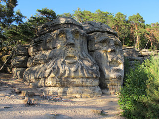 Sandstone rock formation Devils heads (Certovy hlavy) near Zelizy village. Czech Republic