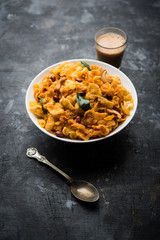 Cornflake Chivda or Corn Chiwda loaded with peanuts and Cashew. Served in a bowl. selective focus