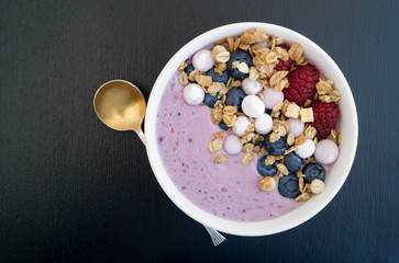 Homemade healthy yogurt with muesli and blueberries.