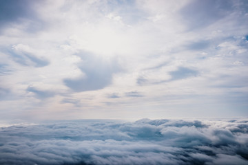 Naklejka premium Awesome view on top of the clouds on a cloudy morning.