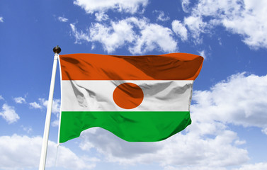 Nigerian Flag Mockup fluttering under a blue sky. West African country. Capital and most populous city: Niamey. Motto: 
