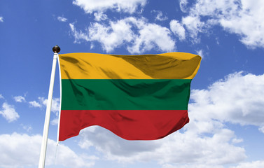 Lithuania flag mockup floating under blue sky. It is a Baltic country and state located in southern Europe. The capital Vilnius is near the border with Belarus. Gediminas Tower on the hilltop
