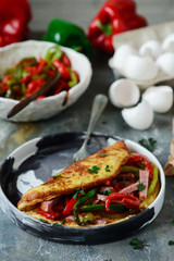 Omelet with pepper and salami.style rustic