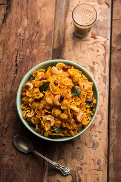 Cornflake Chivda or Corn Chiwda loaded with peanuts and Cashew. Served in a bowl. selective focus