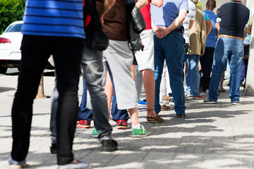 people  queue  in  line up ,  draggle , selective focus