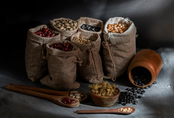 Different types of legumes in dark food style