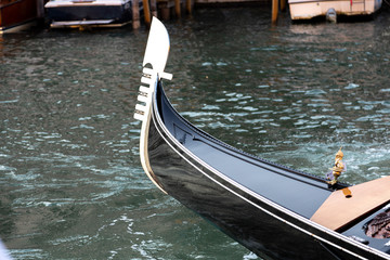 Fototapeta na wymiar Gondola ferro, the metal design at the prow, or front, of the gondola boat.