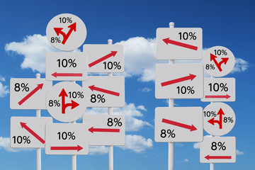混乱する軽減税率8％と10％を指し示す矢印看板と青空と雲