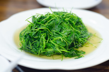 green cooked leafy Chinese vegetables