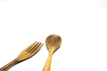 spoon and fork  wooden isolated on white background with selective focus.