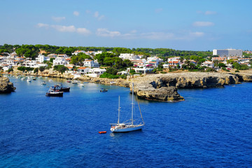 Fototapeta na wymiar View on the beach and village Alcaufar on Menorca.