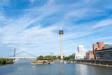 Naklejka na ściany i meble panoramic view of the Medienhafen (Media Harbour) Düsseldorf with rhine in the foreground