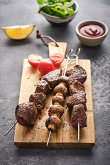 Beef Shish kebab and mushrooms, cherry tomato and ketchup Grilled meat skewers. BBQ lanch