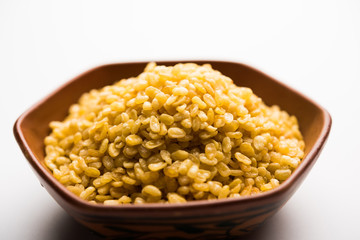 Salty and Fried Moong Dal Namkeen served in a bowl, selective focus