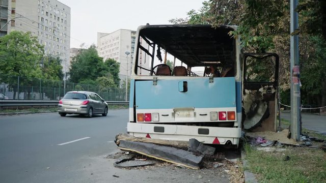 Bus after the fire. Explosion of a bomb in a passenger vehicle. The terrorist act in a bus carrying children. Accident, explosion, set fire. Burnt chairs, broken windows. Human sacrifice. Car accident