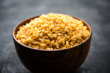 Salty and Fried Moong Dal Namkeen served in a bowl, selective focus