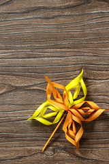 Autumn decor. Colored paper leaves in autumn on wooden background. Crafts from paper for children. Children's art project. Top view flat lay. Free space for your text.