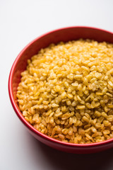 Salty and Fried Moong Dal Namkeen served in a bowl, selective focus