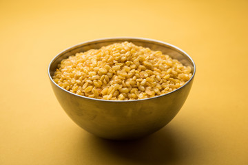 Salty and Fried Moong Dal Namkeen served in a bowl, selective focus