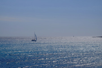 Beautiful view on the sea and sailboat on Menorca,  Balearic Islands.