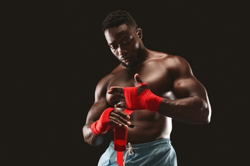 Young african american boxer preparing for fight