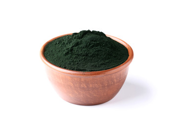 Spirulina powder in bowl isolated on white background