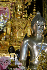 Gold and silver Buddha statues at Wat Pa Dara Phirom, Chiang Mai, Thailand.