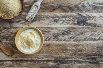 bran oat with yogurt in wooden background
