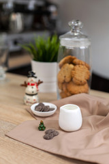 Bar counter in a coffee shop with New Year's decorations, cookies, sweets and coffee
