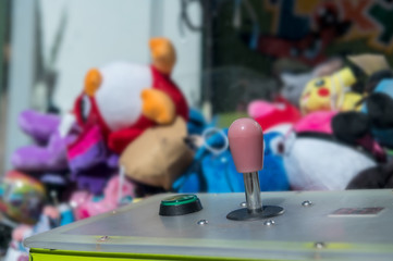 Closeup of a joystick from a Crane Claw Machine Games. Concept: game or gambling addiction