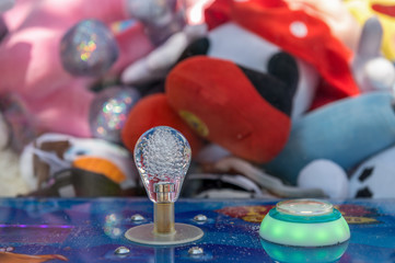 Closeup of a joystick from a Crane Claw Machine Games. Concept: game or gambling addiction