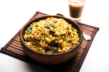 Jada Poha Namkeen Chivda / Thick Pohe Chiwda is a jar snack with a mix of sweet, salty and nuts flavours, served with tea. selective focus