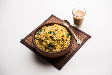 Jada Poha Namkeen Chivda / Thick Pohe Chiwda is a jar snack with a mix of sweet, salty and nuts flavours, served with tea. selective focus