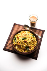 Jada Poha Namkeen Chivda / Thick Pohe Chiwda is a jar snack with a mix of sweet, salty and nuts flavours, served with tea. selective focus
