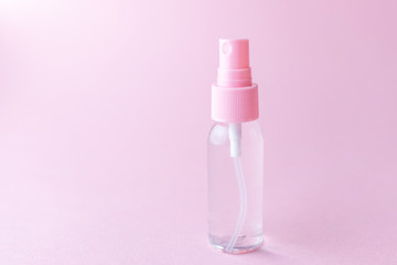 Cosmetic bottle with transparent lotion on a pastel pink background. The concept of cosmetics, skin care, beauty and health. Minimalism, place for text.