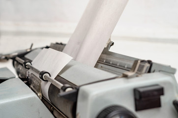 Paper is loaded in the shaft of a mechanical typewriter