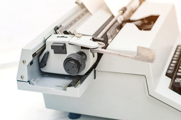 Paper is loaded in the shaft of a mechanical typewriter