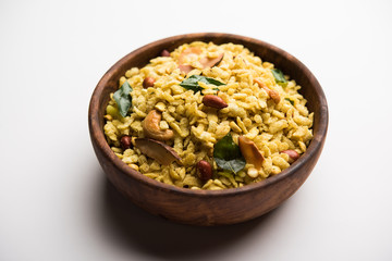 Jada Poha Namkeen Chivda / Thick Pohe Chiwda is a jar snack with a mix of sweet, salty and nuts flavours, served with tea. selective focus