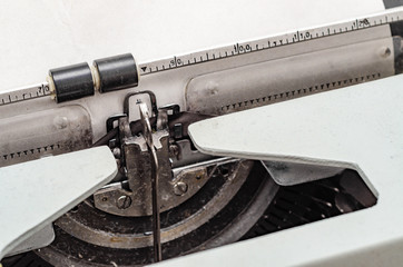 Carriage with letters in a mechanical typewriter. Letter pressed