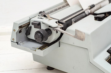 Paper is loaded in the shaft of a mechanical typewriter