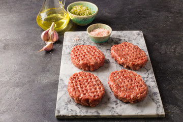 Raw burger cutlet from beef meat
