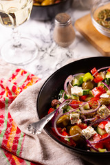 Fresh vegetables and goat cheese salad on the kitchen table