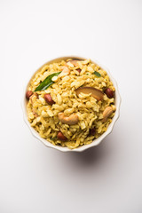 Obraz na płótnie Canvas Jada Poha Namkeen Chivda / Thick Pohe Chiwda is a jar snack with a mix of sweet, salty and nuts flavours, served with tea. selective focus
