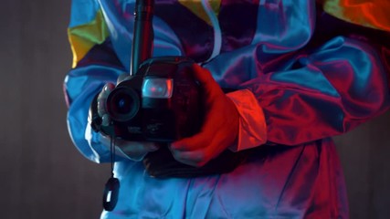 Videographer filming with a vintage 80s 90s VHS video camera.