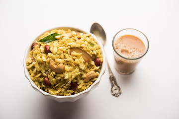 Jada Poha Namkeen Chivda / Thick Pohe Chiwda is a jar snack with a mix of sweet, salty and nuts flavours, served with tea. selective focus