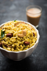 Jada Poha Namkeen Chivda / Thick Pohe Chiwda is a jar snack with a mix of sweet, salty and nuts flavours, served with tea. selective focus