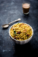 Jada Poha Namkeen Chivda / Thick Pohe Chiwda is a jar snack with a mix of sweet, salty and nuts flavours, served with tea. selective focus