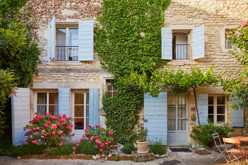 Fototapeta na wymiar Village windows and vines in Provence, France