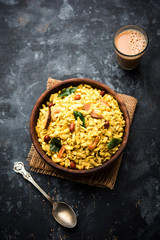 Jada Poha Namkeen Chivda / Thick Pohe Chiwda is a jar snack with a mix of sweet, salty and nuts flavours, served with tea. selective focus